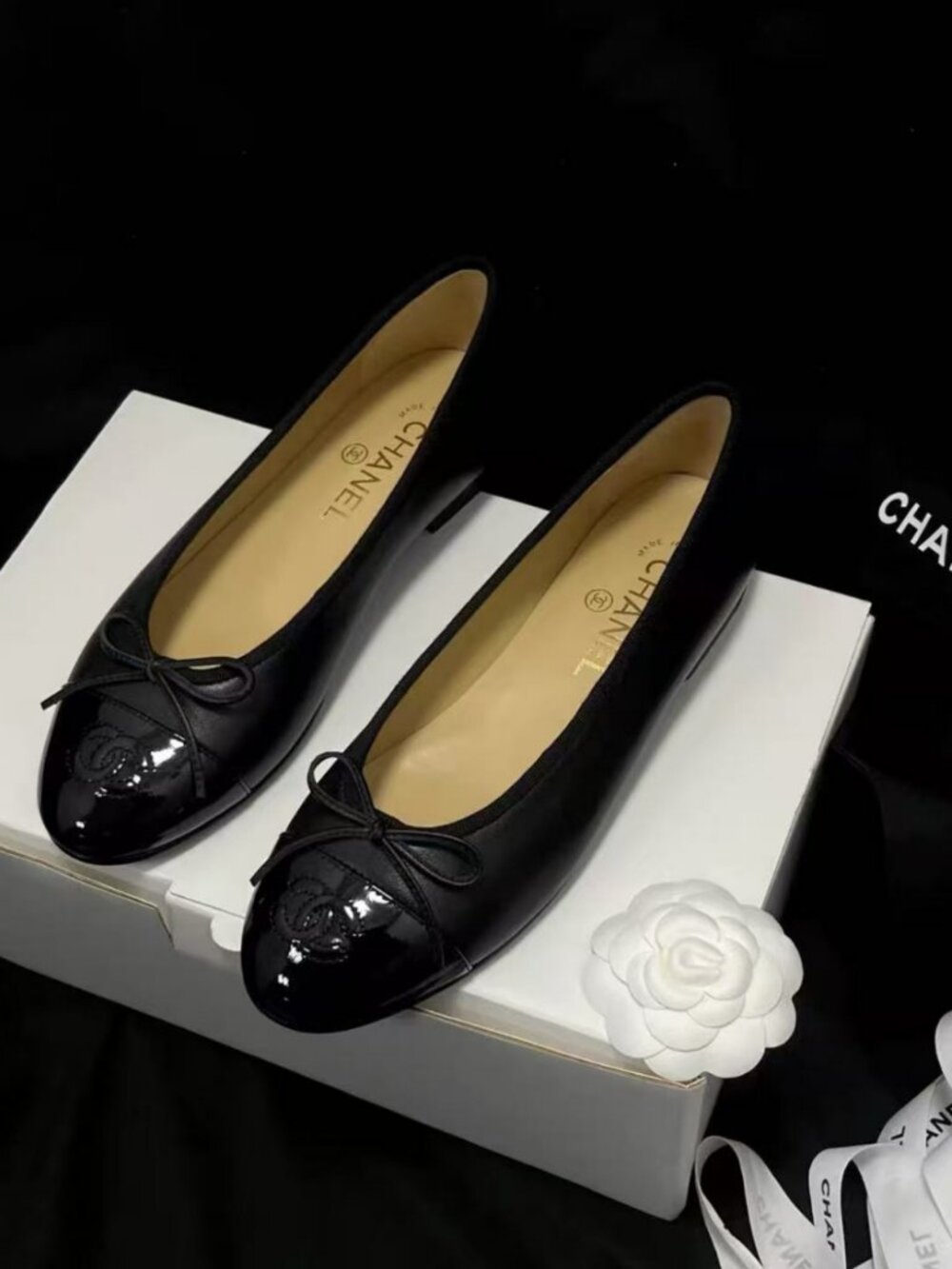 Elegant CHANEL Black Patent‑Tip Bow Ballerina Shoes
